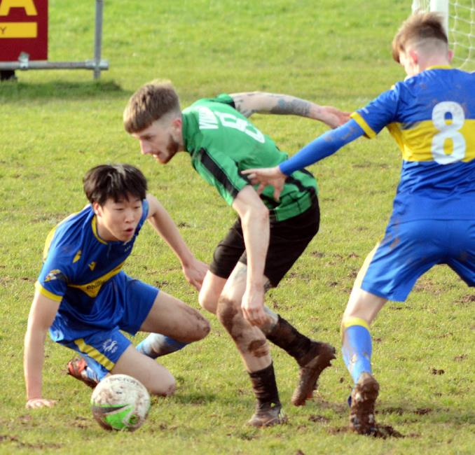 Jay Kilby battles for possession against Seaside